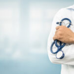 Doctor in hospital background with copy space. Healthcare and medical concept.